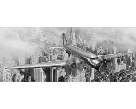 Panoramatická vliesová fototapeta Letadlo nad městem 375 x 150 cm